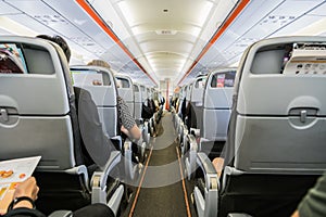 Airplane with passengers on seats waiting to take off