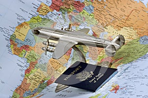 Airplane, passport and map