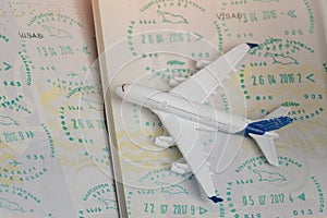 Airplane on passport pages with a visa. Close up