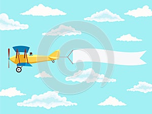 Airplane with pilot and advertising banner in the cloudy sky