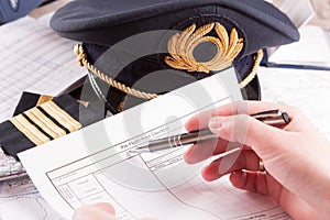 Airplane pilot filling in flight plan