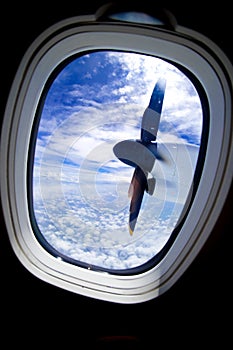 Airplane propeller engine against blue sky closeup