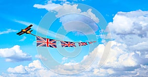 Airplane pulling British flags, union jack