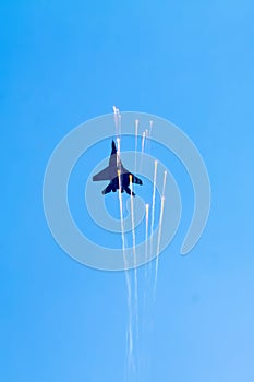 Airplane releases flares on the airshow