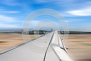 Airplane running on the airport runway - Blurred motion