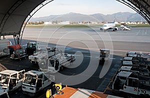 Airplane on runway and hangar