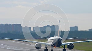 Airplane on the runway, rear view