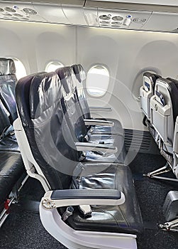Airplane seat row with window