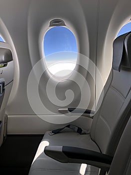 Airplane seat and window inside an aircraft