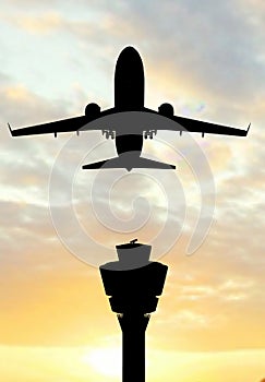 Airplane siluette in the sunset photo