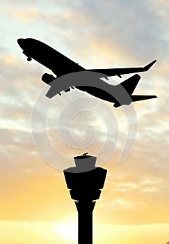 Airplane siluette in the sunset photo