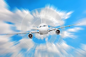 Airplane in the sky above the clouds flight journey sun height speed motion blur.