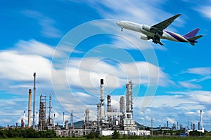 Airplane in the sky over Oil Refinery factory industry