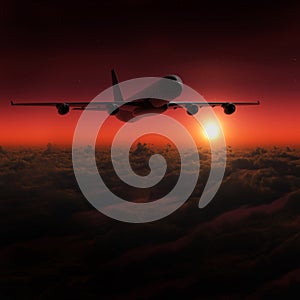 Airplane in the sky at sunset