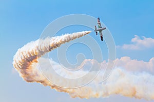 Airplane with smoke on the airshow
