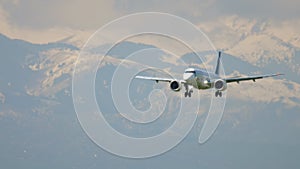 Airplane and snowy mountains