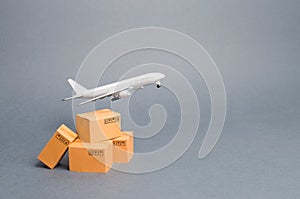 Airplane and stack of cardboard boxes. concept of air cargo and parcels, airmail. Fast delivery of goods and products. Cargo