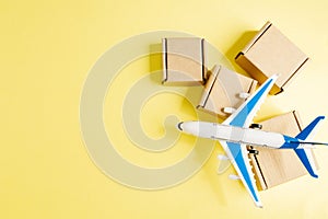 Airplane and stack of cardboard boxes. concept of air cargo and parcels, airmail. Fast delivery of goods and products. Cargo