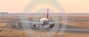 Airplane on a starting runway evening sundown