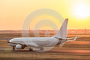 Airplane on a starting runway evening sundown