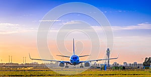 Airplane at sunset at Schiphol