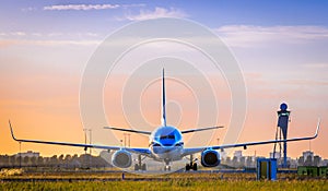 Airplane at sunset at Schiphol