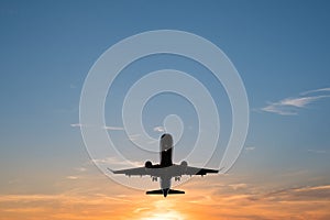 Airplane on sunset sky , aircraft silhouette scenic sky