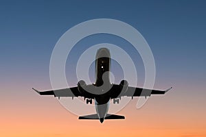 Airplane on sunset sky , aircraft silhouette scenic sky