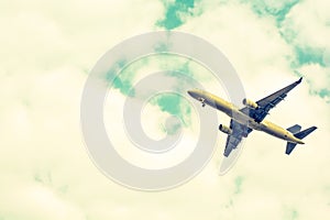 Airplane take-off from runways at cloudy sky.Color sepia