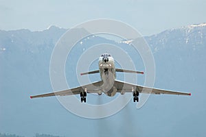 Airplane at takeoff on mountain background