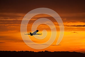 Airplane takeoff in sunset