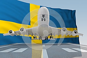 Airplane taking off against the background of the flag Sweden