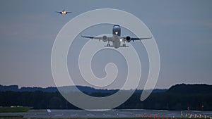 Airplane taking off at dusk