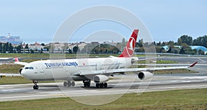 Airplane taxiing on runway of the airport