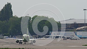 Airplane on taxiway, rear view