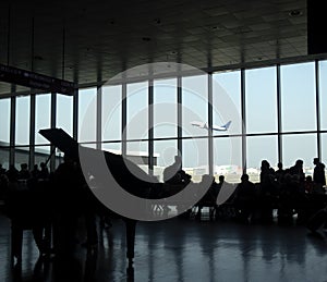 Airplane at the terminal gate ready for takeoff. Modern international airport