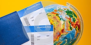 The airplane tickets with globe. Travel concept Passport on a map of the world. Globe map on a background.Departure and Arrival