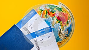 The airplane tickets with globe. Travel concept Passport on a map of the world. Globe map on a background.Departure and Arrival