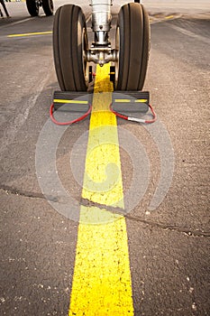 Airplane tires on yellow line