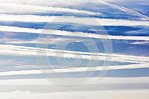 Airplane trails and lines in blue sky