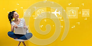 Airplane travel theme with woman using a laptop