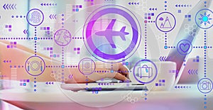 Airplane travel theme with woman using a laptop