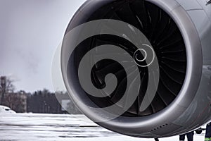 Airplane turbine. Engine blades. Airport in the winter in the snow. Airplane propeller. Turbine blades of an aircraft jet engine.