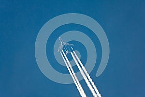 Airplane vapor trails photo