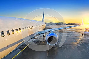 Airplane view of the passenger at the entrance, sunrise and parking in the airport engine