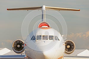 Airplane view straight ahead, on the cockpit and engines on the tail