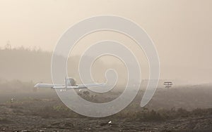 An airplane will take off, a lot of fog around during the morning