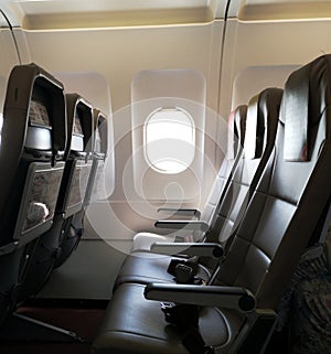 Airplane window cabin with empty seats