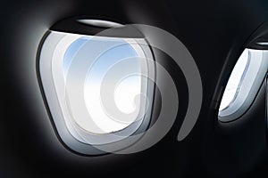 Airplane window view to cloudy sky and earth. Beautiful landscape from aircraft cabin. Flying without fear of flying, incidents