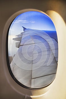 Airplane window wing blue vert